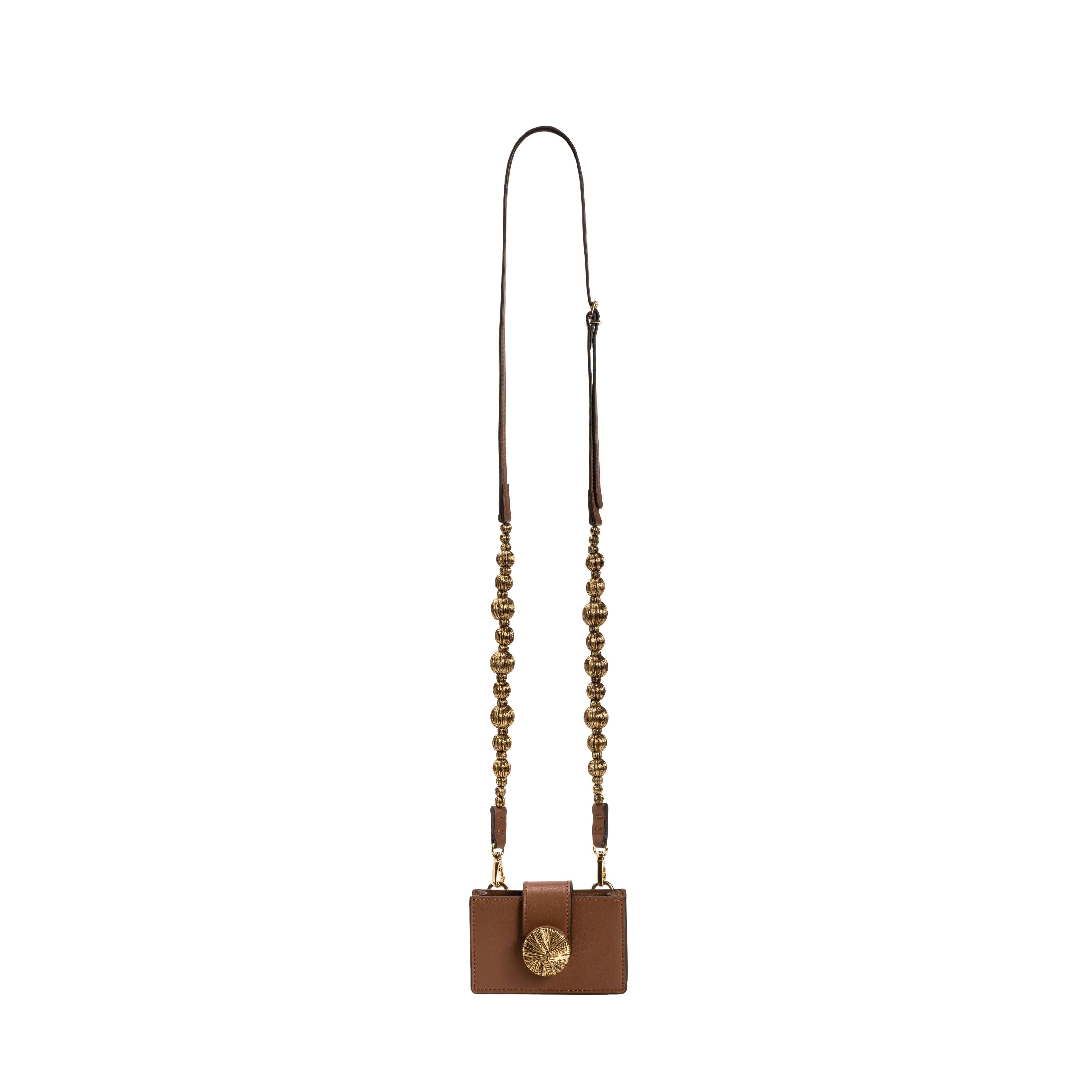 Alessa Camello Card Holder with removable strap featuring embroidered balls and a signature metallic thread detail.