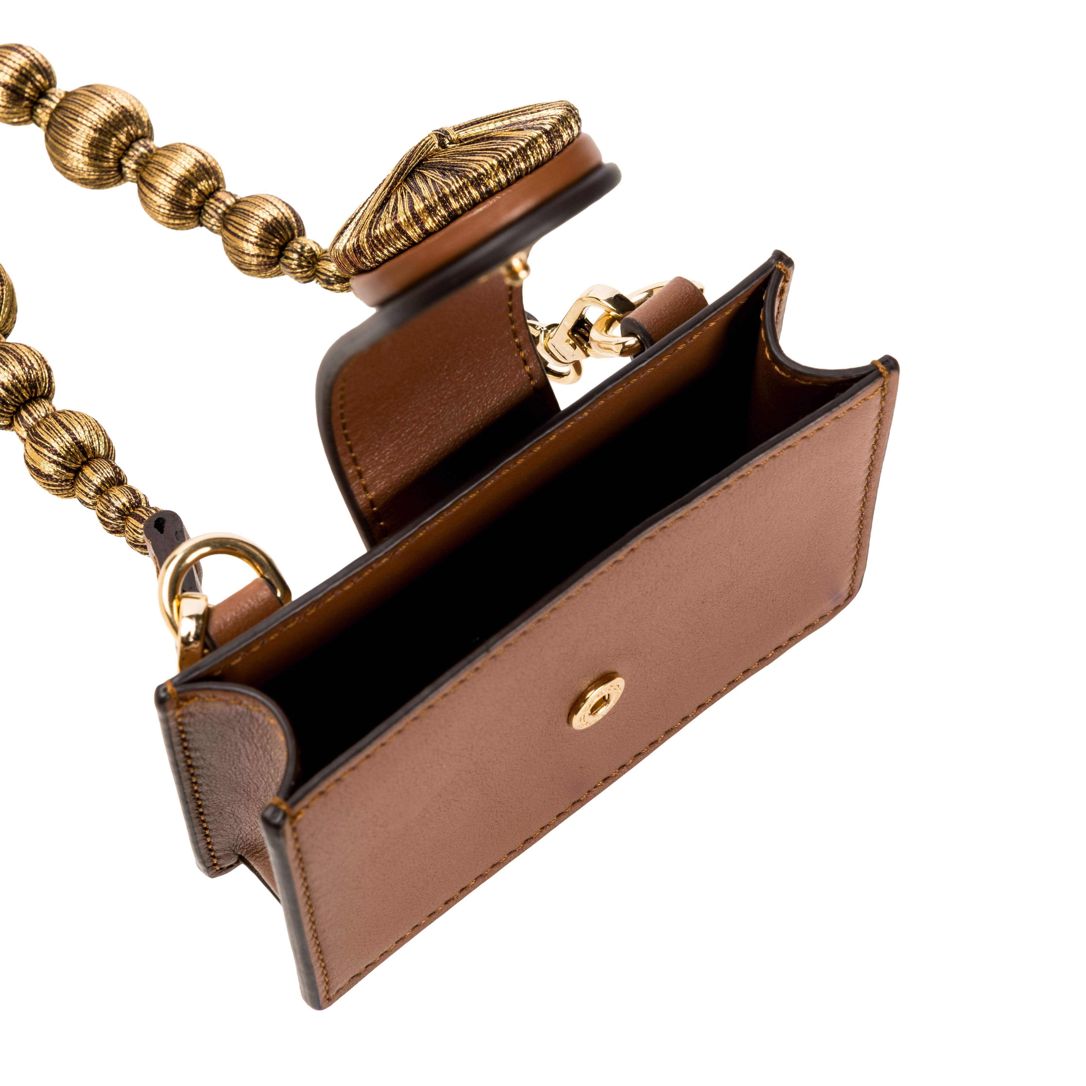 Open Alessa Camello card holder showcasing handcrafted metallic details and detachable embroidered strap.