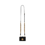 Alessa Black Card Holder with gold details and a sculptural detachable strap, showcasing artistry and sophistication.