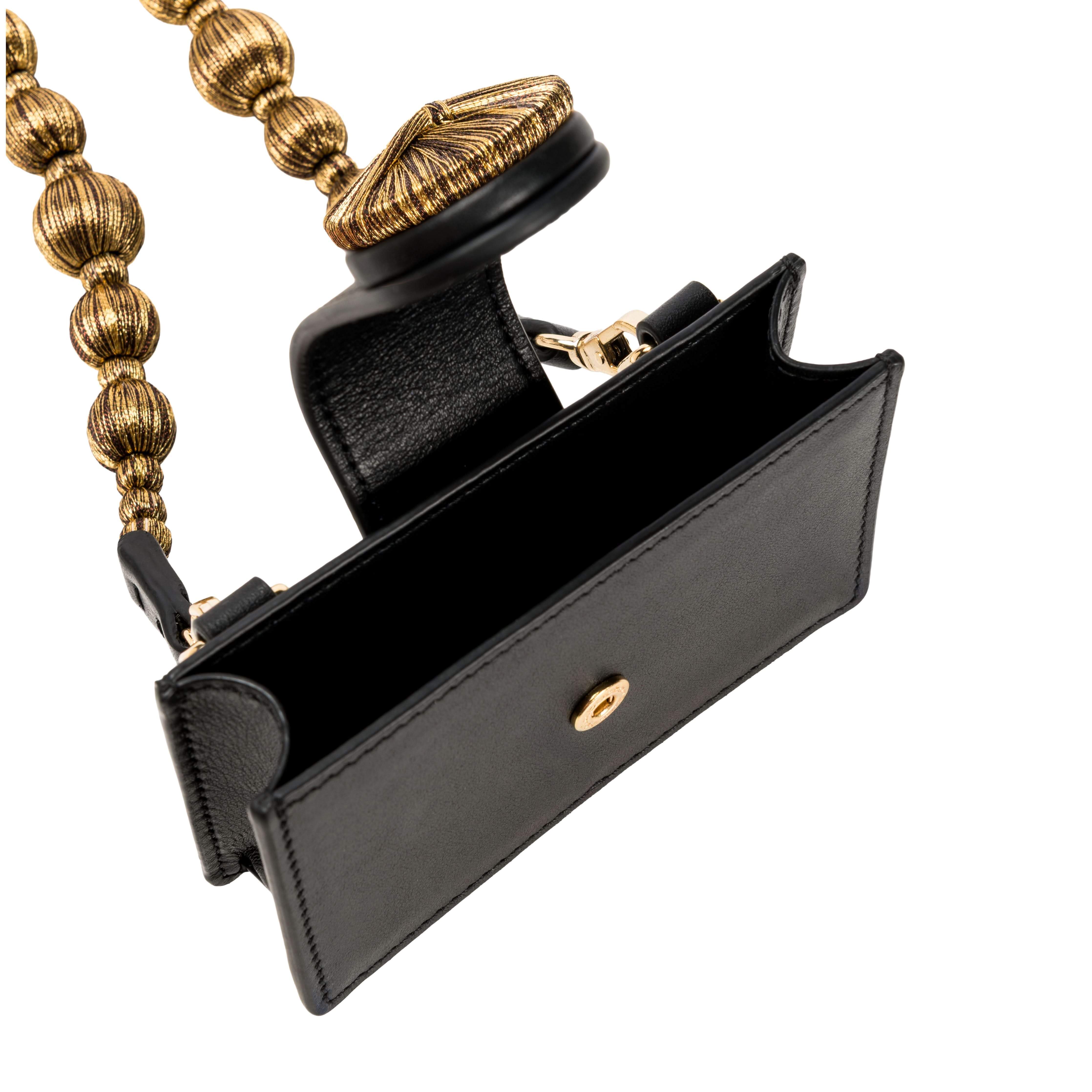 Alessa Black Card Holder featuring a sculptural design with metallic embroidered balls and signature fastening.