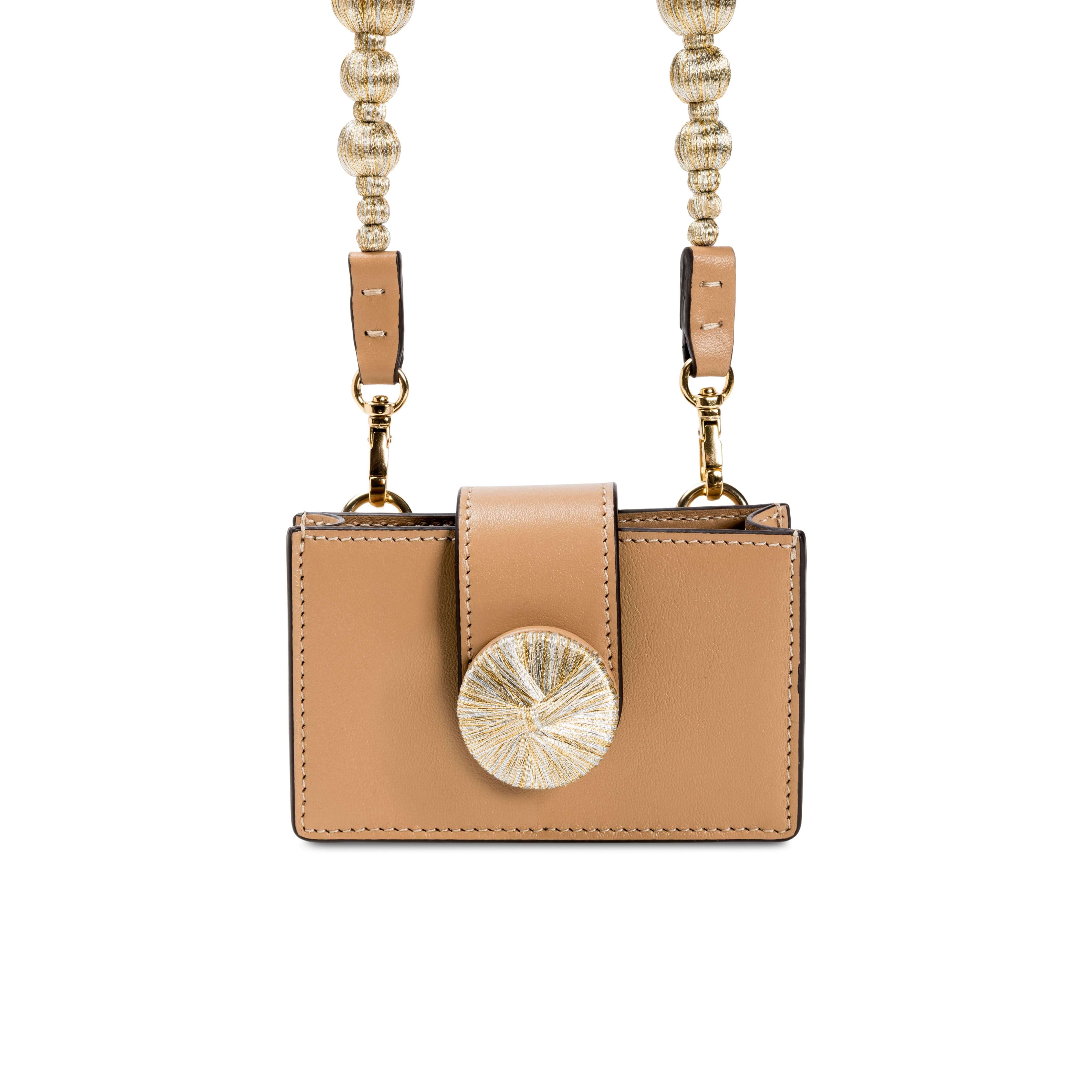 Alessa Cappucino Card Holder featuring a handcrafted metallic threaded design and an embroidered disc closure with a detachable strap.