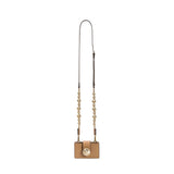 Alessa Cappuccino Card Holder with a decorative detachable strap featuring embroidered balls and signature metallic details.