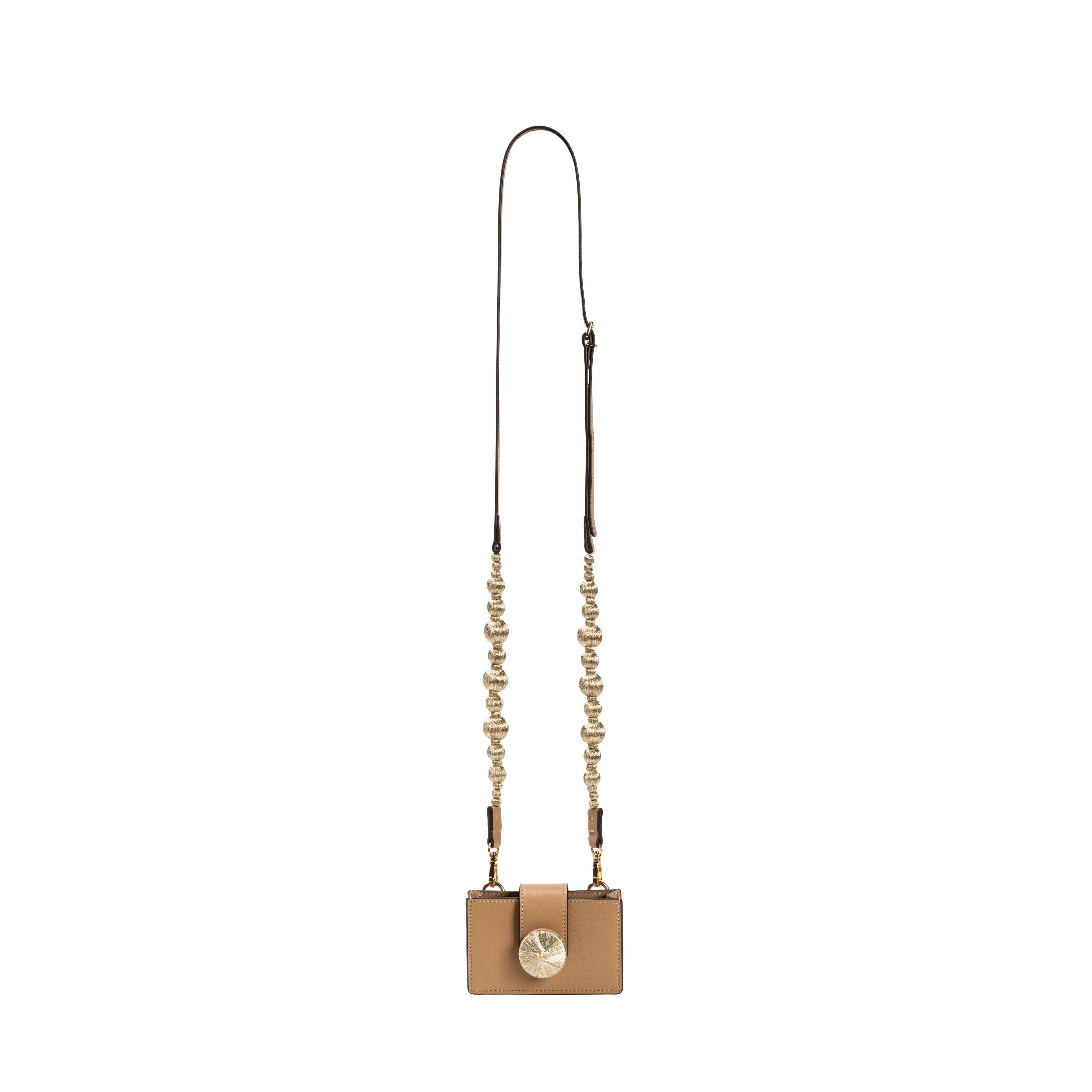 Alessa Cappuccino Card Holder with a decorative detachable strap featuring embroidered balls and signature metallic details.