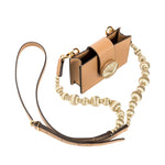 Alessa Cappucino Card Holder with detachable strap and embroidered details, showcasing a refined and sculptural design.