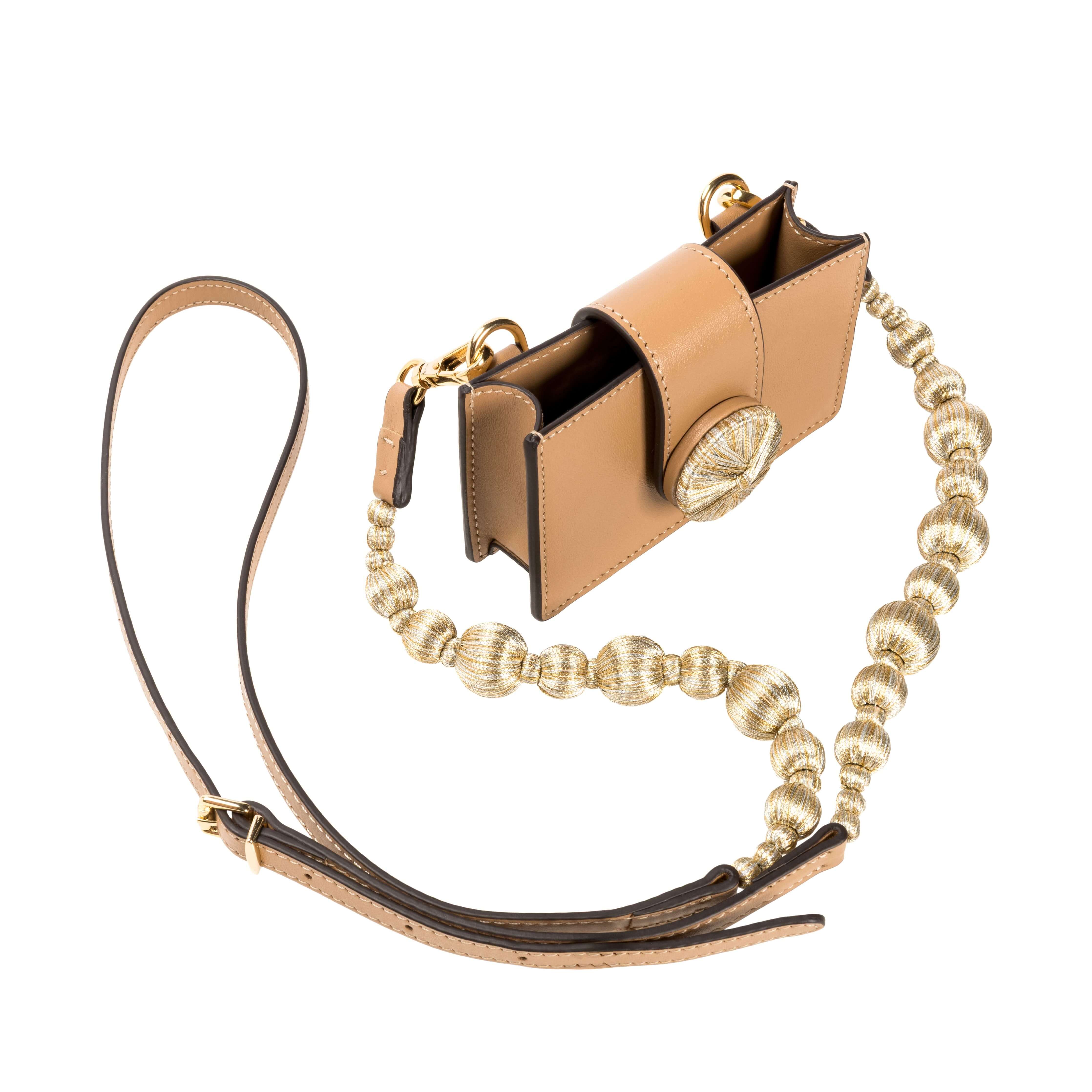 Alessa Cappucino Card Holder with detachable strap and embroidered details, showcasing a refined and sculptural design.