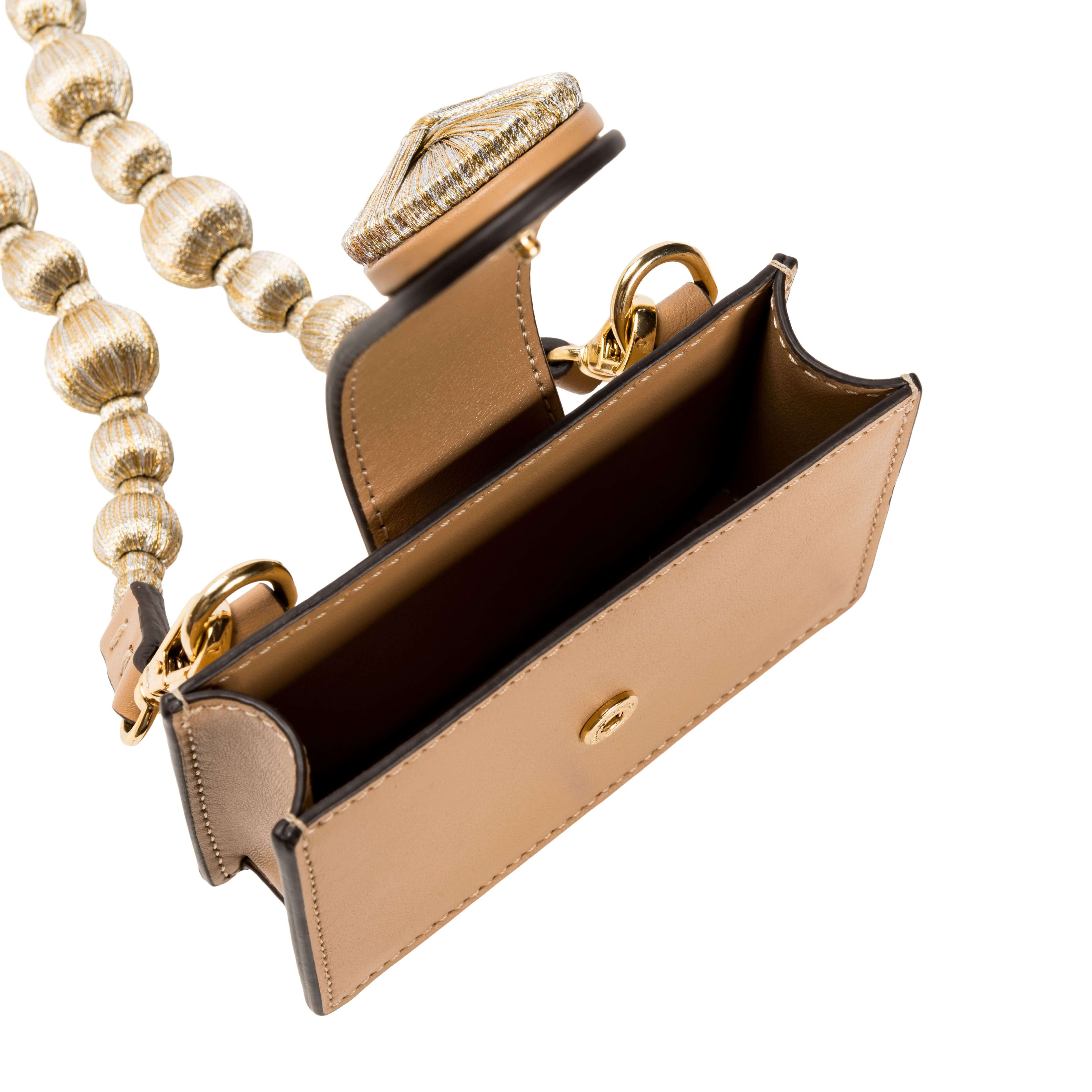 Alessa Cappucino Card Holder featuring metallic threads and embroidered strap, showcasing luxury craftsmanship and unique design.