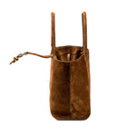 Boho chic medium camello tote bag featuring soft suede texture, stylish design, and practical drawstring closure.
