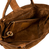 Interior view of the Boho Chic Medium Camello Tote Bag featuring soft suede texture and multiple pockets for organization.