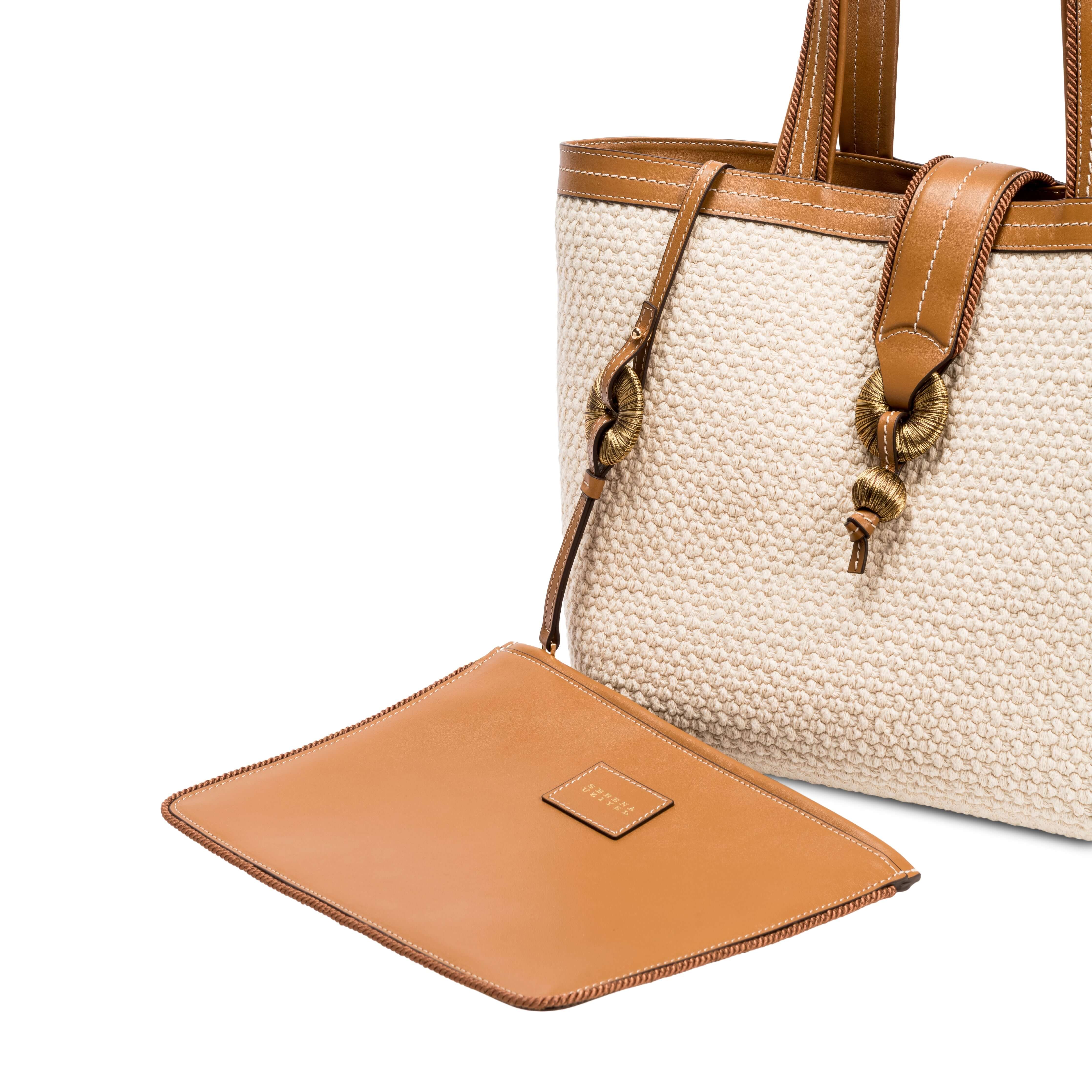 Elegant off-white Boho Chic tote bag with brown leather accents and detachable pouch, perfect for stylish outings.