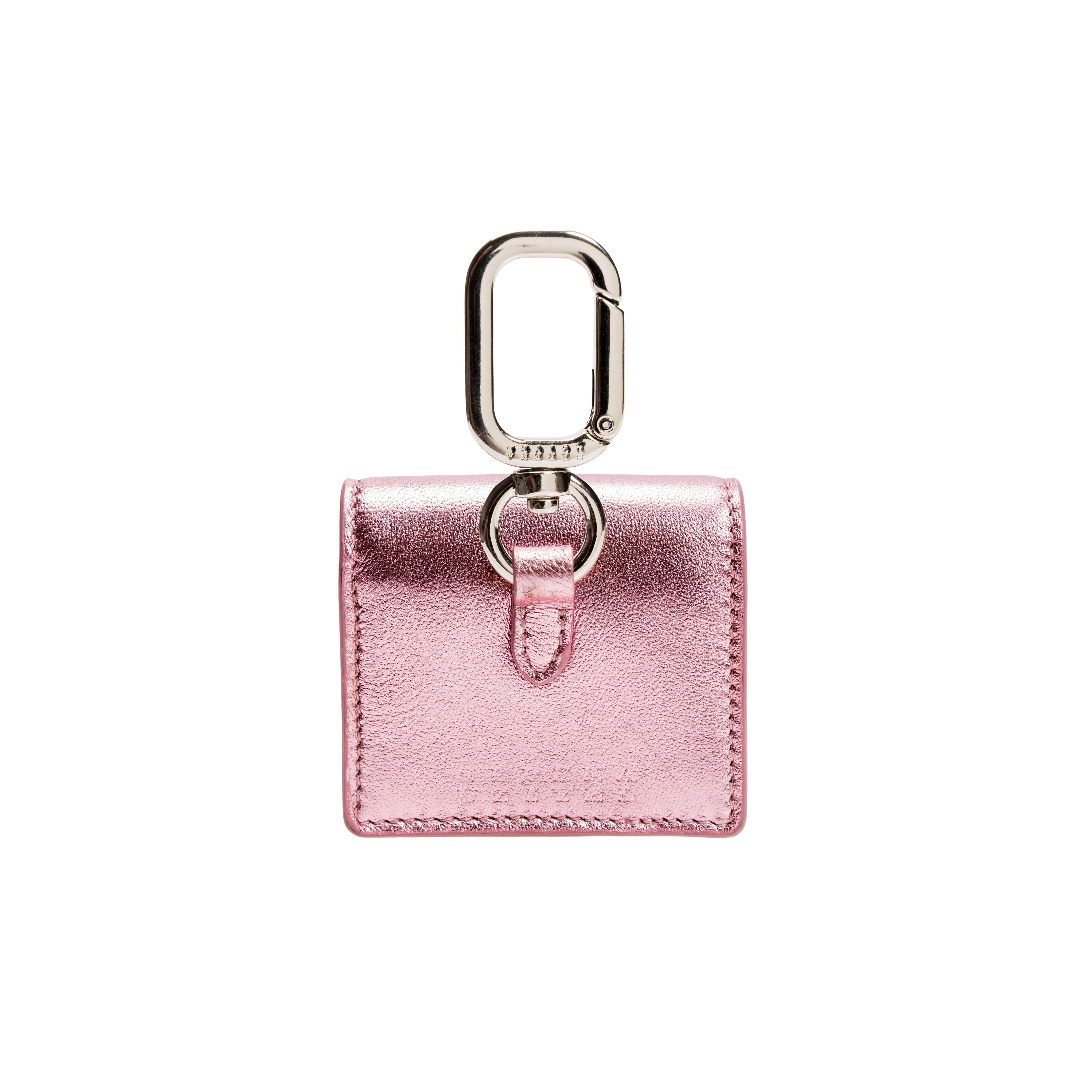 Catena Notte Metallic Pink AirPods Case with a sleek design and silver clip, perfect for stylish accessory lovers.