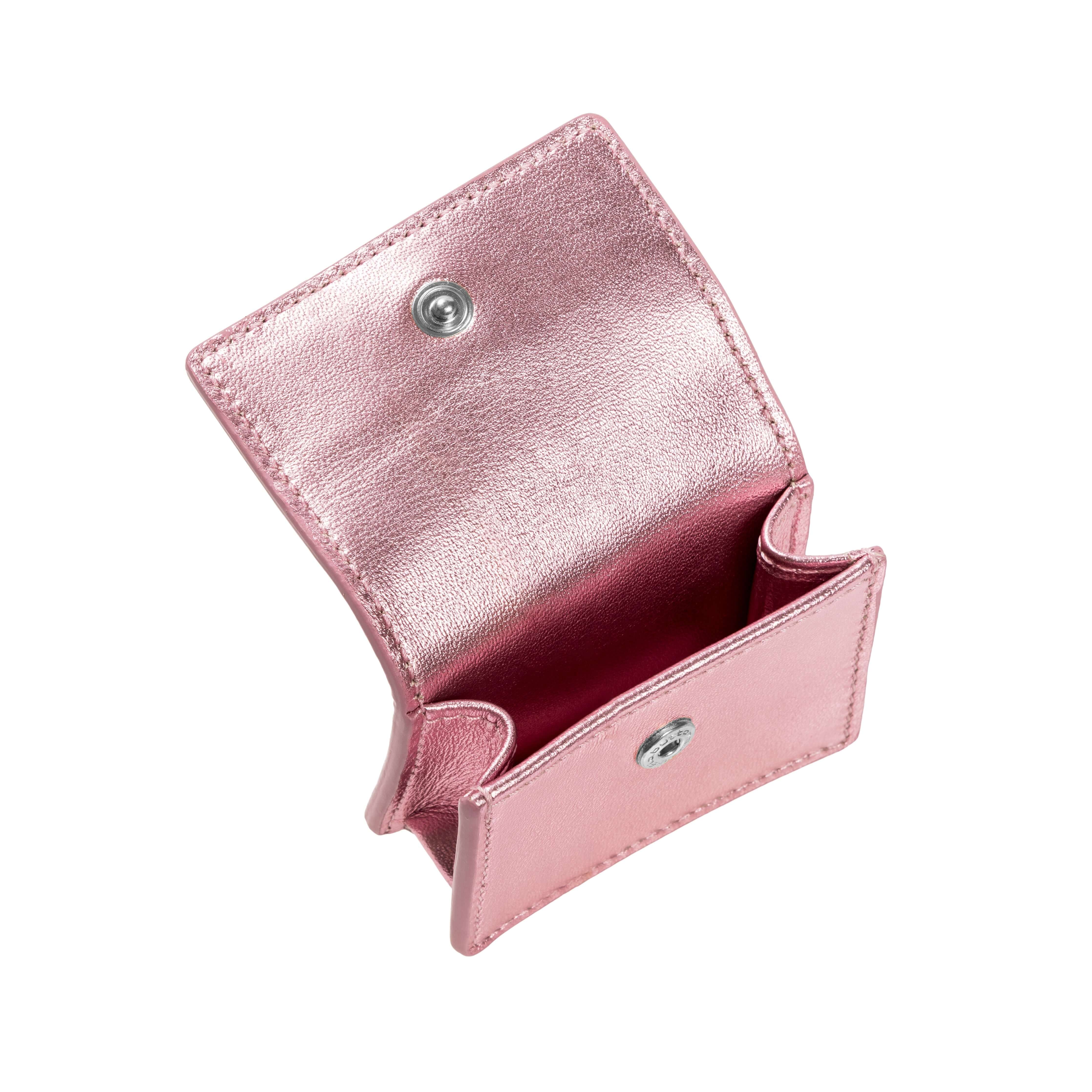 Metallic pink AirPods case with a stylish design, featuring a snap closure and open interior for easy access.