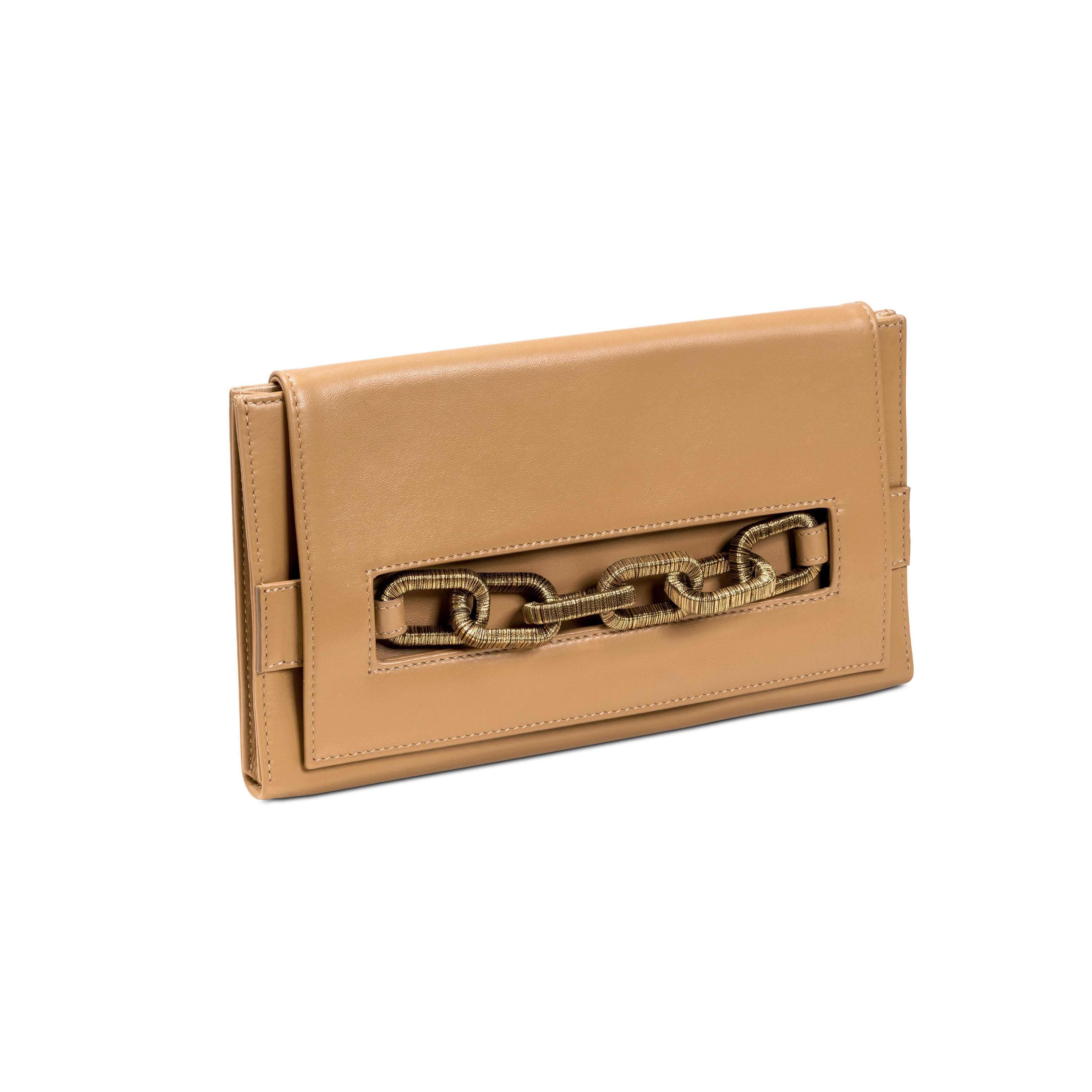 Stylish beige clutch bag featuring an antique gold chain accent, perfect for trendy outings and elegant occasions.