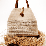 Elegant Melita Natural Large Tote Bag in woven raffia with silk tassel, perfect for summer style and retro-chic looks.
