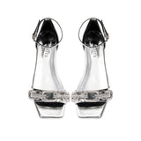 Catena Mirror Flat Ankle Sandal featuring clear straps and a chic design, perfect for stylish summer outings.