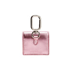 Catena Notte Metallic Pink AirPods Case with a sleek design and silver clip, perfect for stylish accessory lovers.