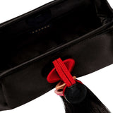Inside view of the Alessa Black Pouch Bag featuring a magnetic closure and decorative tassel.