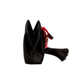 Alessa Black Pouch Bag showcasing its modern design and silk satin texture with a striking tassel detail.