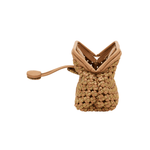 Aurnia Latte Mini Pouch Bag showcasing hand-woven basketry and leather strap, perfect summer accessory.