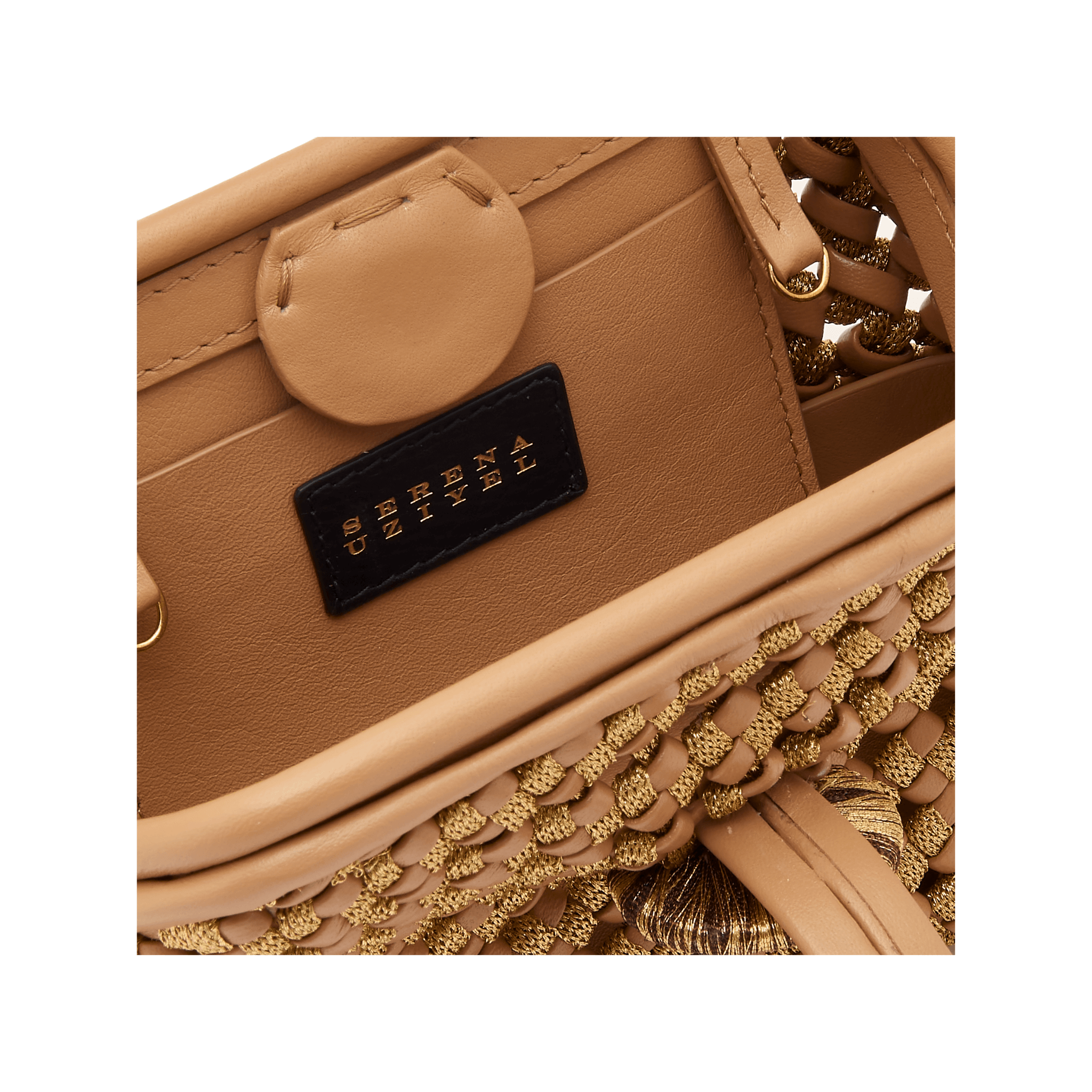 Interior view of the Aurnia Latte Mini Pouch Bag showcasing handwoven texture and the Serena Uziyel label.
