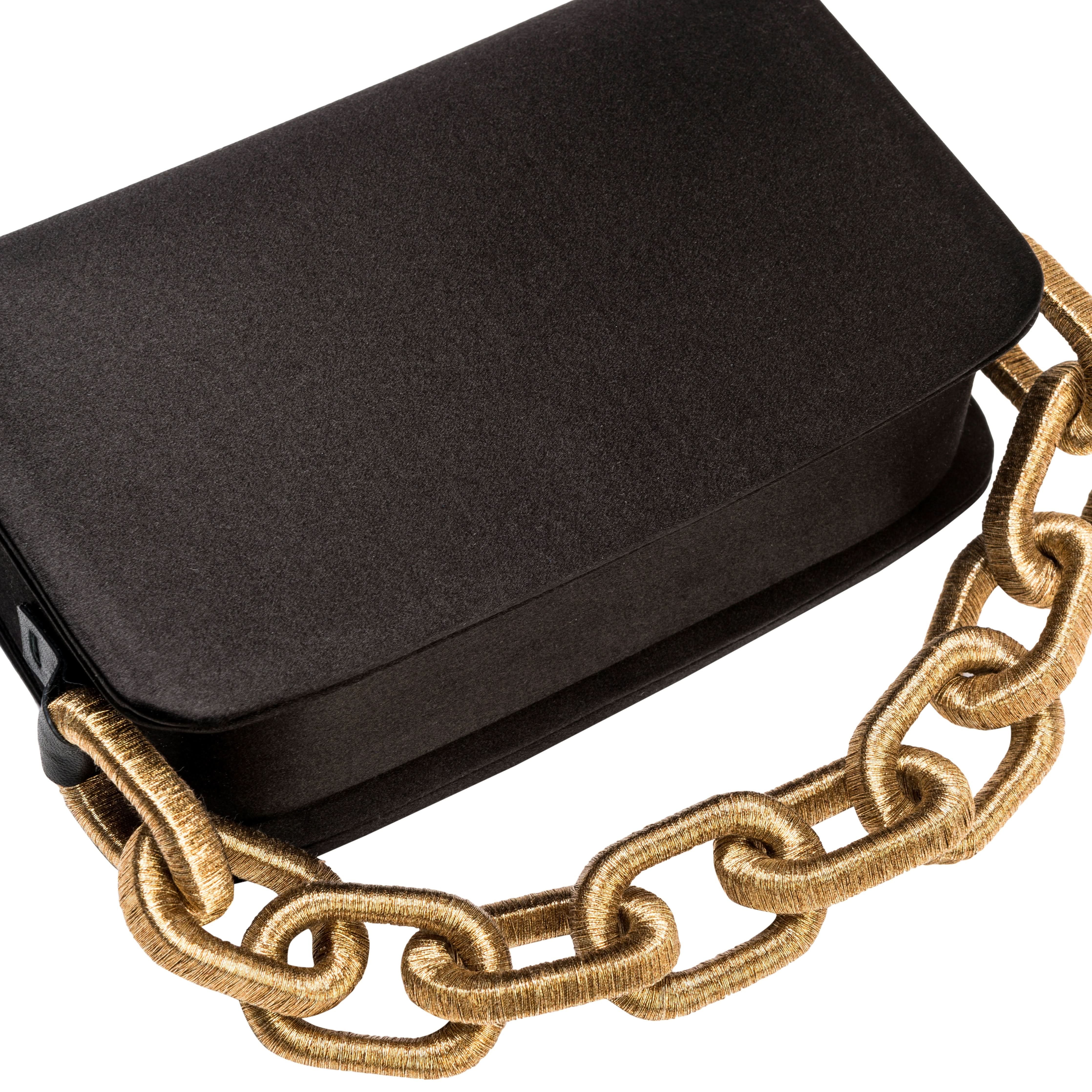 Catena Black Two-Sided Bag in luxurious black silk satin with a gold chain-link handle.