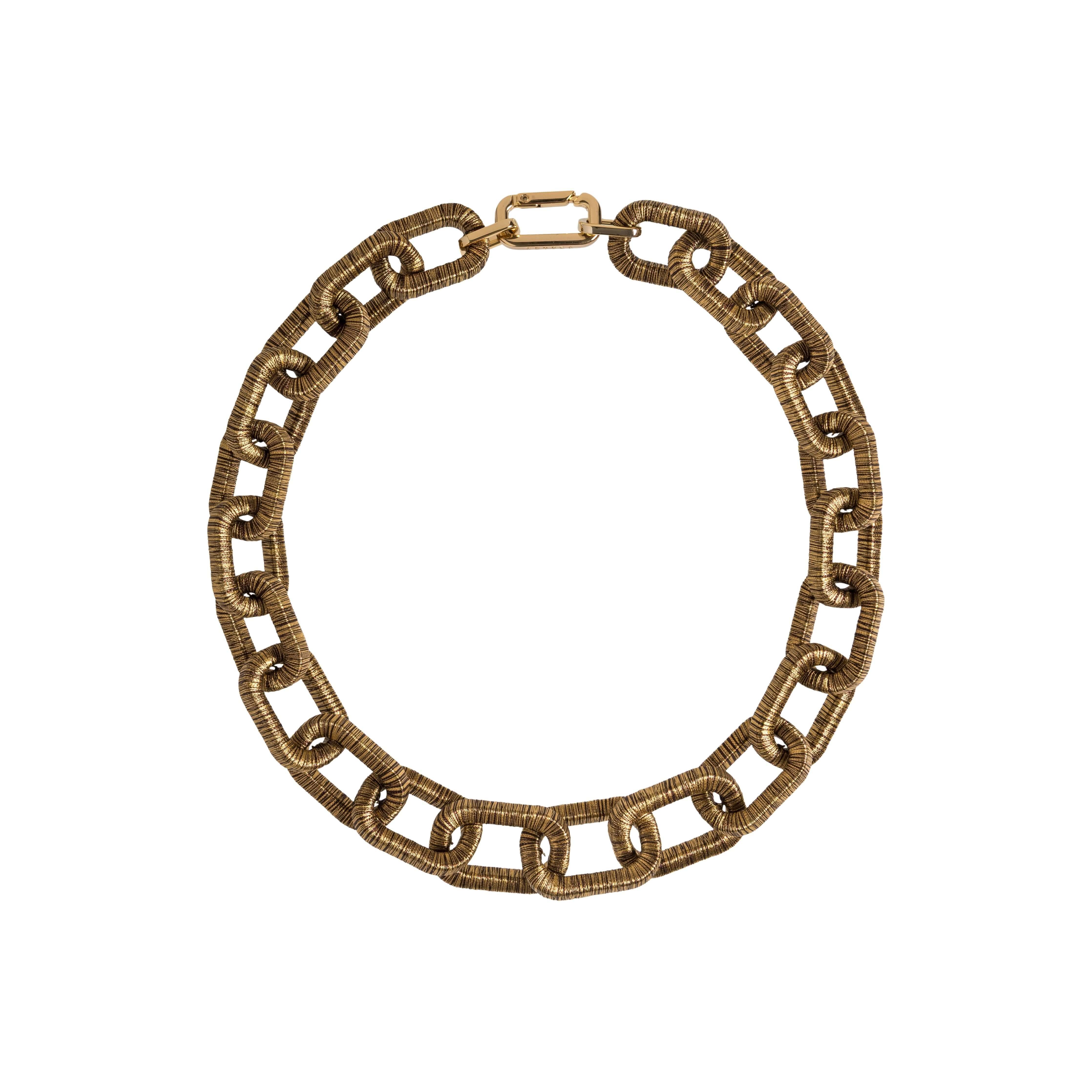 Catena Necklace in antique gold featuring a unique link design, perfect for adding elegance to any outfit.