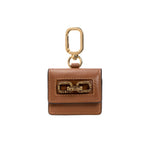 Catena Notte Camello AirPods case in brown leather with gold chain detail and keychain attachment.