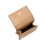 Open tan leather wallet with a snap closure, showcasing its interior compartments.
