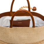 Interior view of Melita Natural Large Tote Bag featuring brown leather handles and a stylish design.
