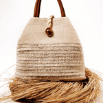 Elegant Melita Natural Large Tote Bag in woven raffia with silk tassel, perfect for summer style and retro-chic looks.